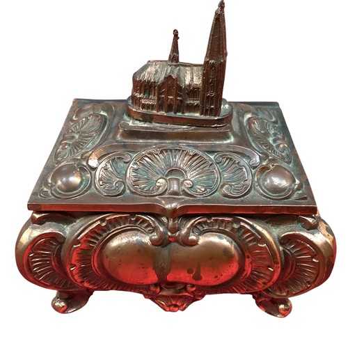 417 - A Continental copper decorative music box, with church finial, much wear and rubbing.