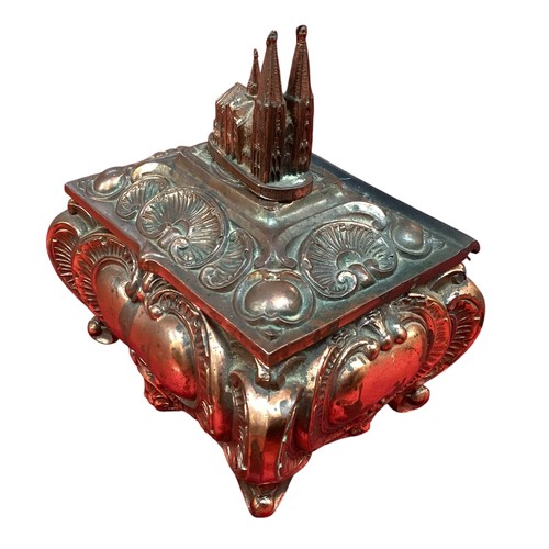 417 - A Continental copper decorative music box, with church finial, much wear and rubbing.