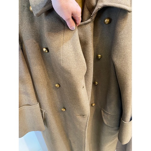 220 - Two wool army style overcoats. Green with double breasted brass style buttons, some damage/repairs a... 