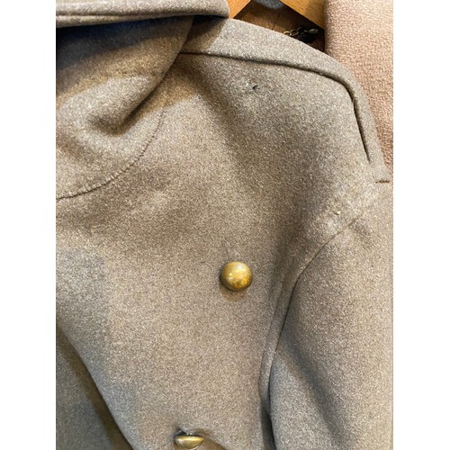 220 - Two wool army style overcoats. Green with double breasted brass style buttons, some damage/repairs a... 