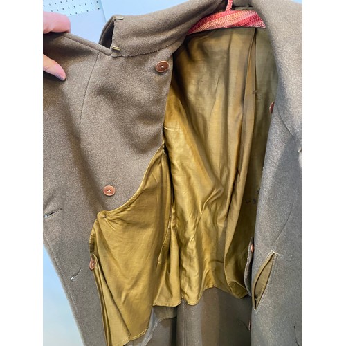 220 - Two wool army style overcoats. Green with double breasted brass style buttons, some damage/repairs a... 