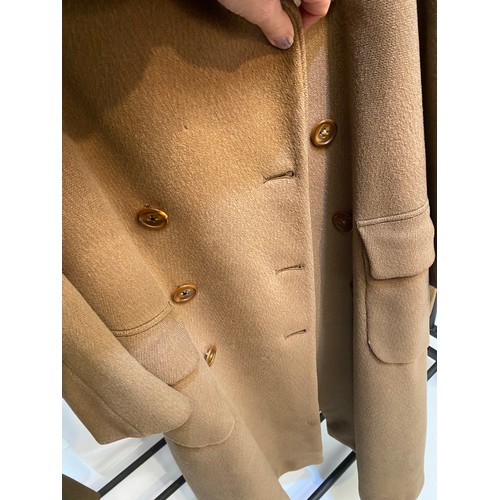 220 - Two wool army style overcoats. Green with double breasted brass style buttons, some damage/repairs a... 