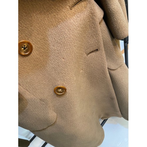 220 - Two wool army style overcoats. Green with double breasted brass style buttons, some damage/repairs a... 