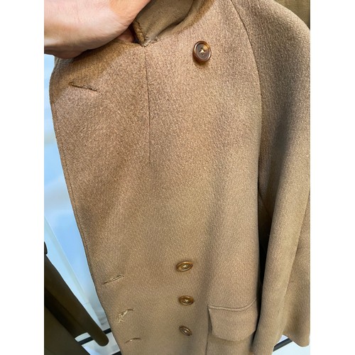 220 - Two wool army style overcoats. Green with double breasted brass style buttons, some damage/repairs a... 