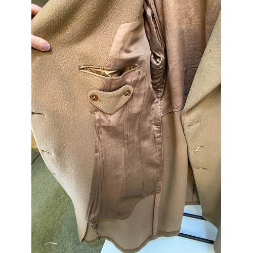 220 - Two wool army style overcoats. Green with double breasted brass style buttons, some damage/repairs a... 