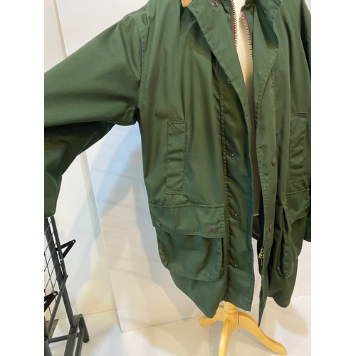 222 - Green GoreTex John Partridge country coat with brown collar size L. Condition good, small stain to c... 