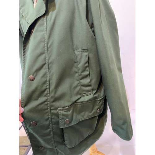 222 - Green GoreTex John Partridge country coat with brown collar size L. Condition good, small stain to c... 