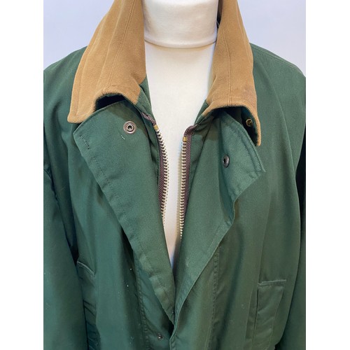 222 - Green GoreTex John Partridge country coat with brown collar size L. Condition good, small stain to c... 