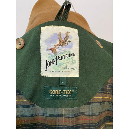 222 - Green GoreTex John Partridge country coat with brown collar size L. Condition good, small stain to c... 