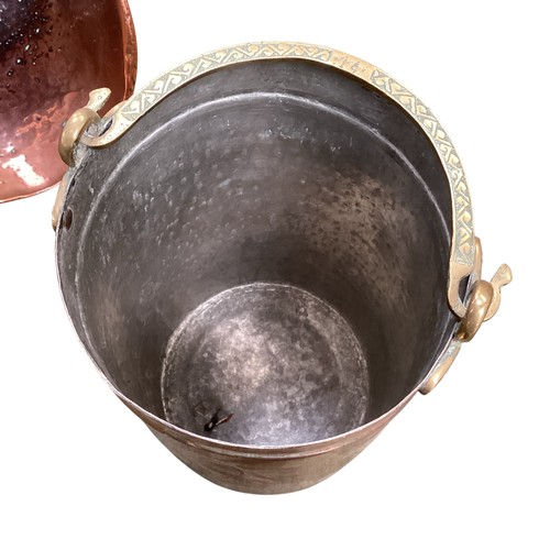 459 - A brass coal scuttle and a brass and copper bucket with handle.