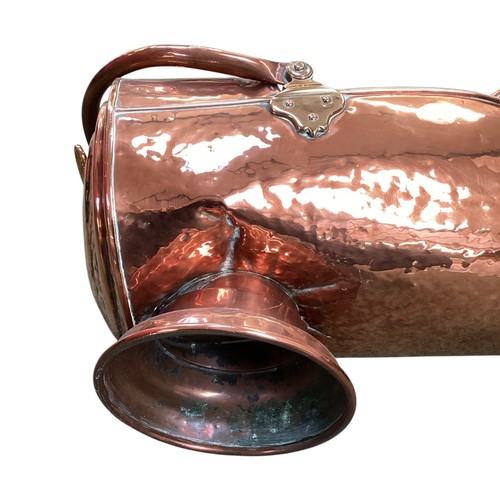 459 - A brass coal scuttle and a brass and copper bucket with handle.