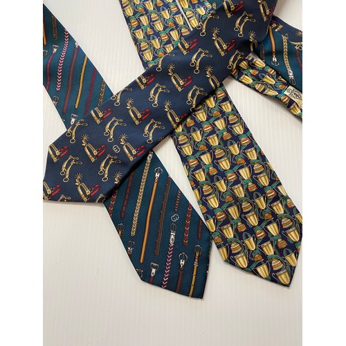 235 - Three Gucci silk ties - green background with belts, navy background with gold cups, navy background... 