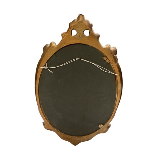 504 - Five wall mirrors to include: Three wall mirrors, to include an oval mirror the frame decorated with... 