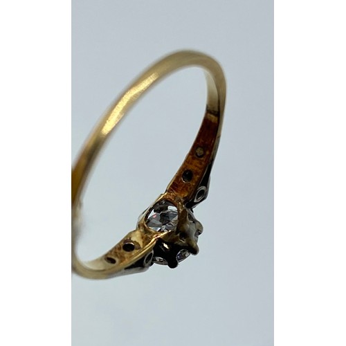 277 - An 18ct gold and white metal diamond ring, central brilliant cut 5mm diamond, with rose cut diamond ... 