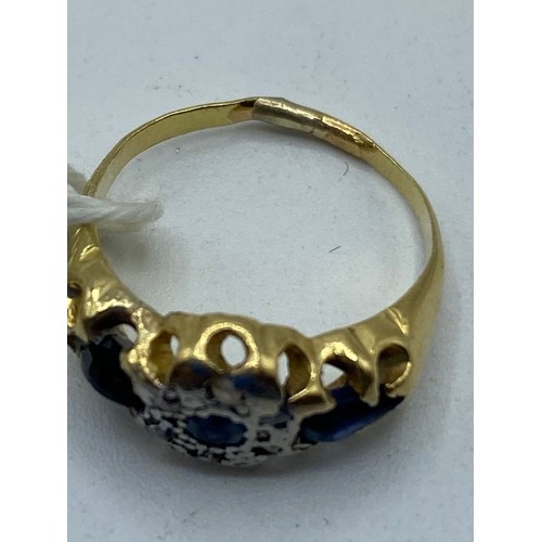 261 - A 9ct gold sapphire and diamond ring, central free cut sapphire with 3.8mm diamond brilliant cut acc... 