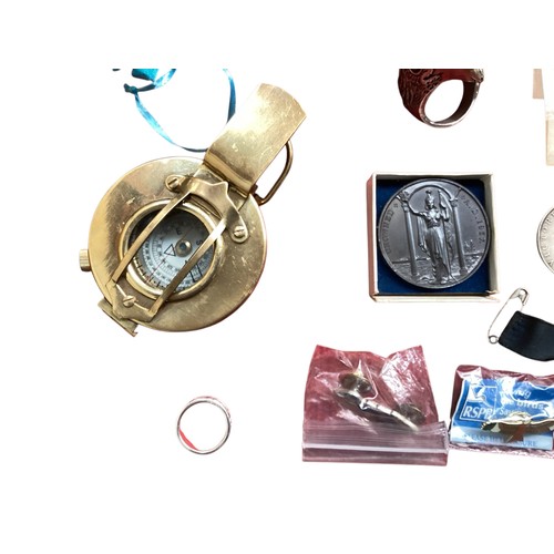 493 - A collection of sterling silver and white metal items together with coins, medallions and a brass co... 