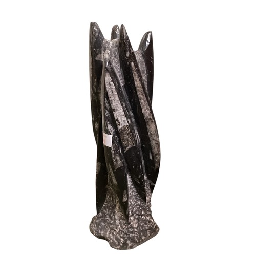 490 - An Orthoceres statue. 34cm(h)