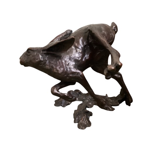 486 - A collection of bronze and composite resin models of animals.Otter, rabbits and hares.