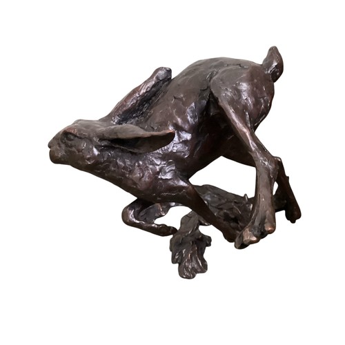 486 - A collection of bronze and composite resin models of animals.Otter, rabbits and hares.