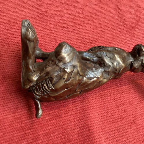 486 - A collection of bronze and composite resin models of animals.Otter, rabbits and hares.