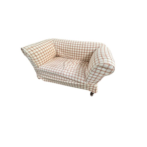 654 - A small two seater drop end sofa, raised on four legs, some wear and dirt, for re-upholstery