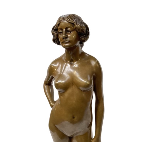 482 - Ernst Wagner (1877-1951) A Bronze model of a standing nude lady. Etched signature. On a hexagonal ha... 