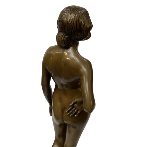 482 - Ernst Wagner (1877-1951) A Bronze model of a standing nude lady. Etched signature. On a hexagonal ha... 