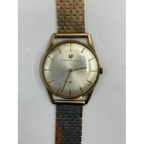 291 - A GIRARD-PERREGAUX gentleman's 9ct gold cased wrist watch on a 9ct gold bracelet strap, ivory colour... 