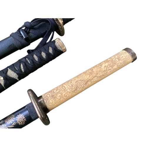 496 - Two samurai style swords on stand with one other.