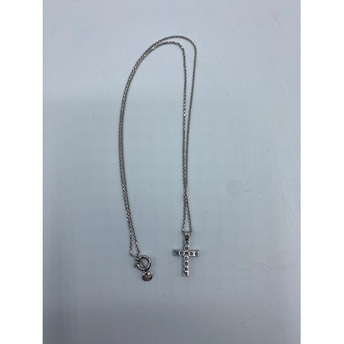 271 - An 18ct white gold and diamond set crucifix pendant on an 18ct white gold chain link necklace, 4.2g