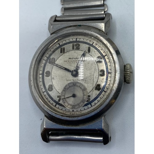 330 - A gents watch, stamped to face MOVADO, Hamilton & Co, Calcutta, serial number stamped to clasp, and ... 