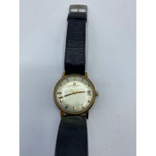 330 - A gents watch, stamped to face MOVADO, Hamilton & Co, Calcutta, serial number stamped to clasp, and ... 