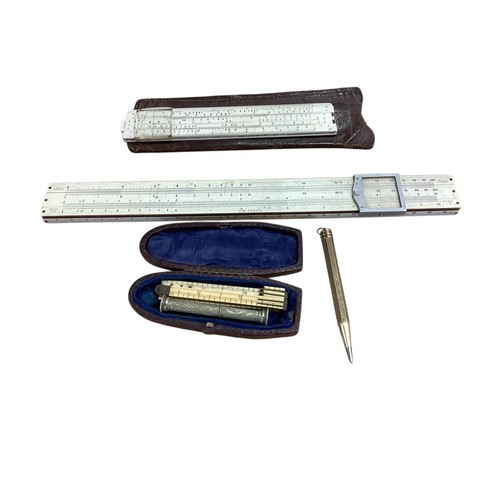 266 - A 585 marked, 14ct gold propelling pencil together with some boxed  draughtsmen's slides.