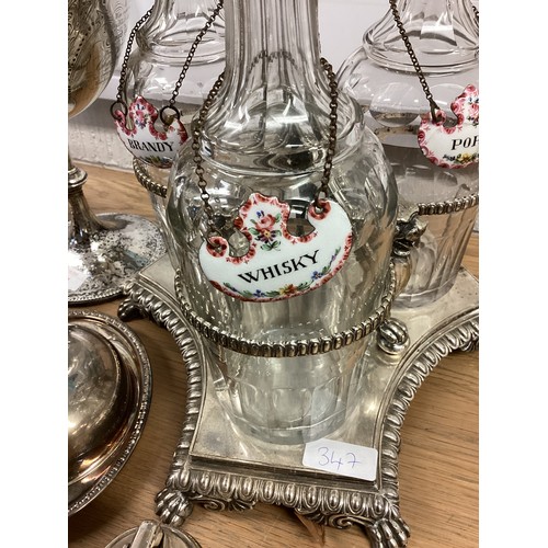 347 - A large quantity of white metal, condiment set caddy with porcelain decanter labels, silver plate, f... 