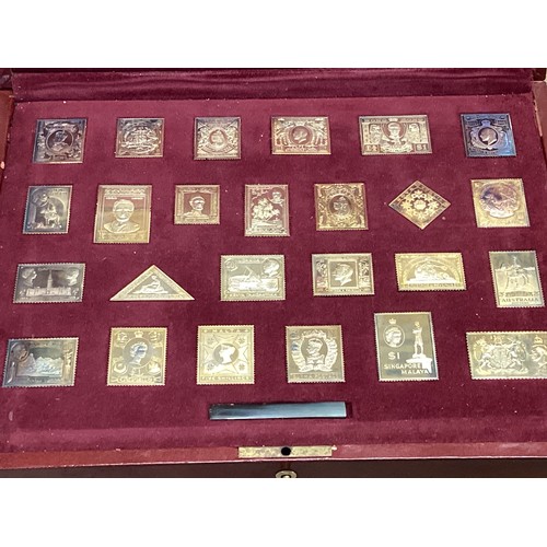 354 - Franklin Mint gilt silver Empire Collection stamp set in original fitted box with certificate of aut... 