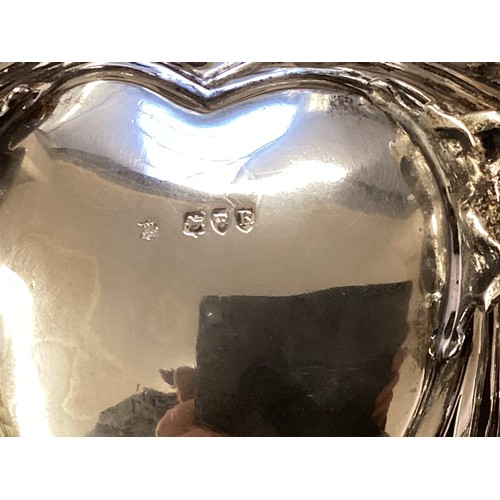 344 - A Pair of sterling silver heart shaped dishes with pierced decoration by EH London 1892.  640g