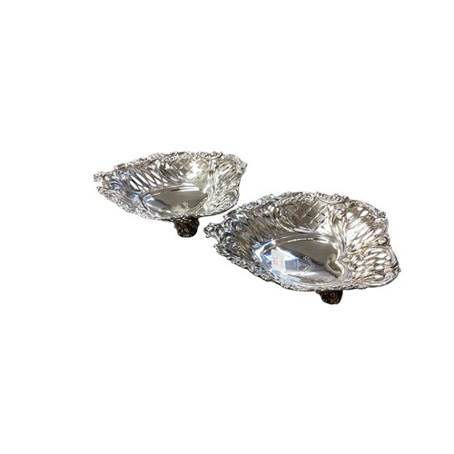 344 - A Pair of sterling silver heart shaped dishes with pierced decoration by EH London 1892.  640g