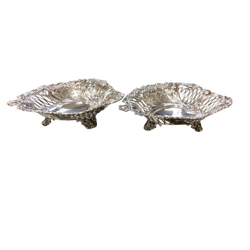 344 - A Pair of sterling silver heart shaped dishes with pierced decoration by EH London 1892.  640g