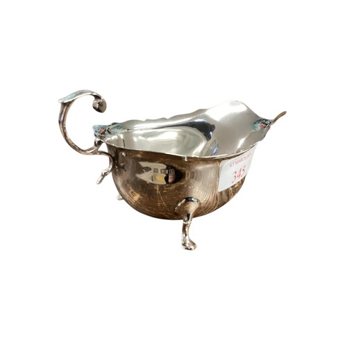 345 - A sterling silver sauce boat. Walker and Hall Birmingham. 91g