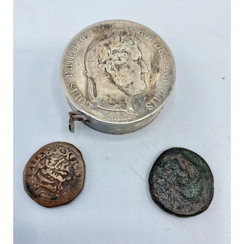 333 - A HERMES Continental hallmarked white metal  coin set tape measure, and two coins of antiquity.