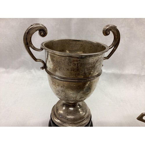 348 - Two  items of hallmarked silver, to include three  old trophy cups and a white metal cigarette box.