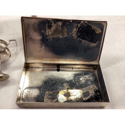 348 - Two  items of hallmarked silver, to include three  old trophy cups and a white metal cigarette box.