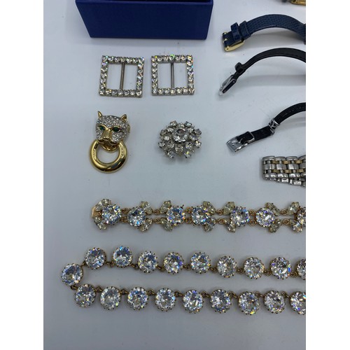 265 - A quantity of costume jewellery, High Street Watches and two pieces of Swarvoski jewellery.