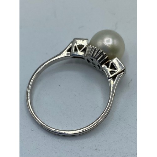 311 - A single pearl ring with baguette cut diamond accents (Size M), a BIRKS small three tier triple amet... 