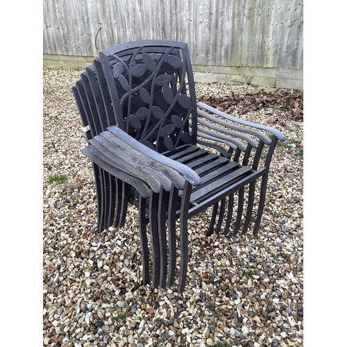 660 - A pair of upholstered button back gilt painted armchairs and a set of six metal garden chairs