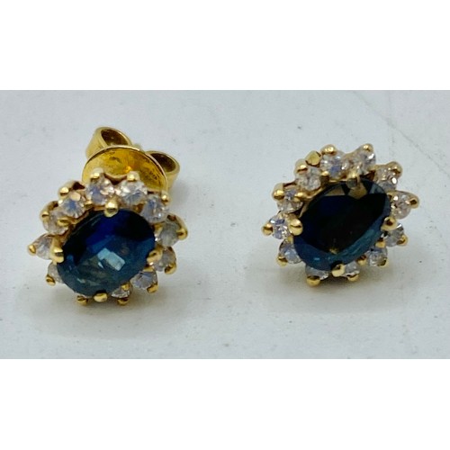 310 - A pair of oval ear studs, sapphire with diamond accent surrounds, and a rose metal  ID bracelet (unm... 