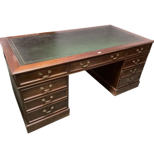 617 - A good large nine drawer pedestal desk, with green tooled leather inset top, 182.5cm wide x 90.5 dep... 