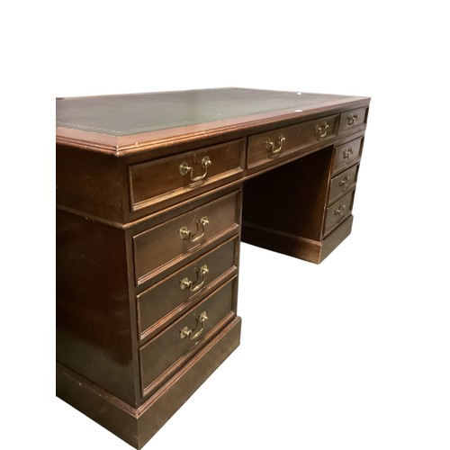 617 - A good large nine drawer pedestal desk, with green tooled leather inset top, 182.5cm wide x 90.5 dep... 