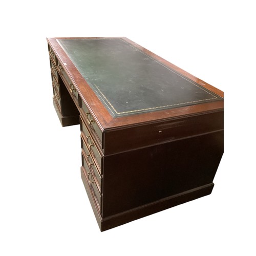 617 - A good large nine drawer pedestal desk, with green tooled leather inset top, 182.5cm wide x 90.5 dep... 