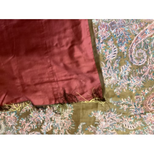 214 - Two Paisley throws/tablecloths both with damage and repairs. Two patterned throws/tablecloths. Embro... 